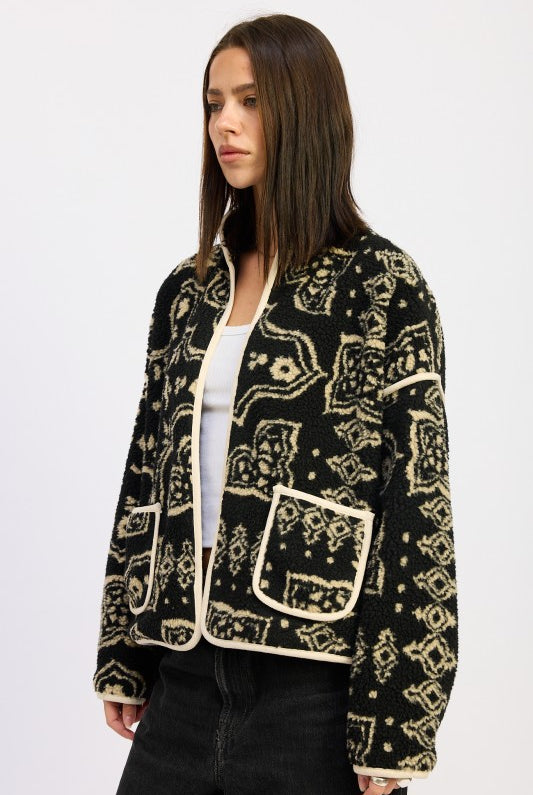 Side view highlighting black and taupe pattern with contrast trim- AVAH