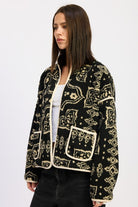 Side view highlighting black and taupe pattern with contrast trim- AVAH