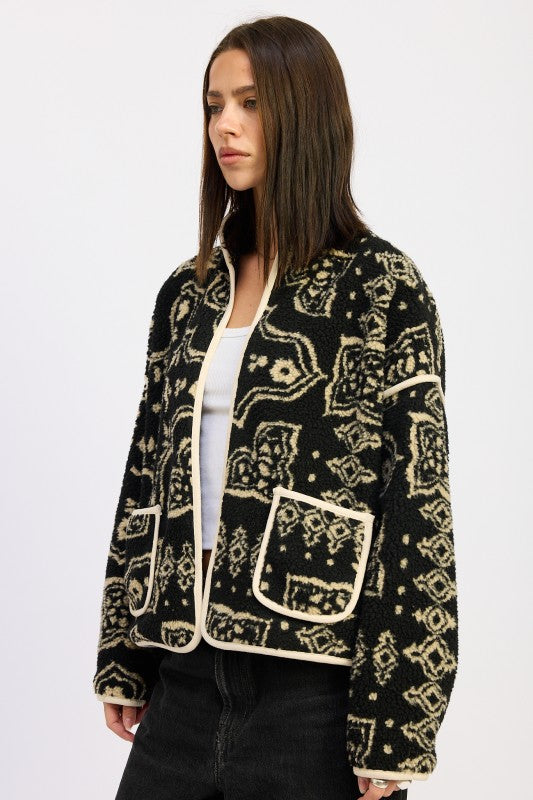Side view highlighting black and taupe pattern with contrast trim- AVAH