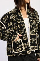 Close-up of sherpa texture and contrast-trim front pockets.