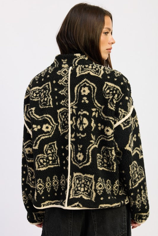 Back view of printed sherpa jacket showing bold motif and structured seams.