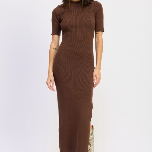 Model wearing mocha ribbed midi dress with short sleeves and snake boots.