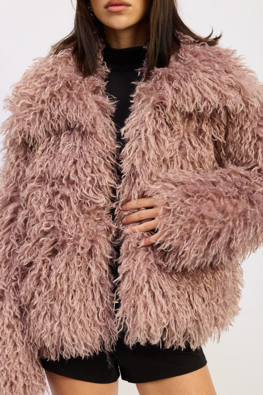 Zoomed-in view of the mauve curly textured coat showing the plush pile and collar detail.
