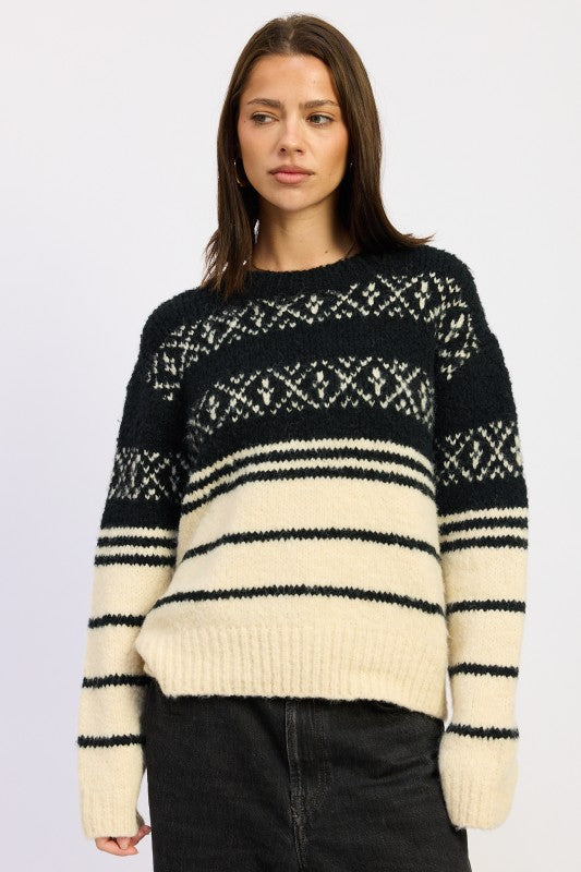 Black and cream Fair Isle crewneck sweater on model facing forward