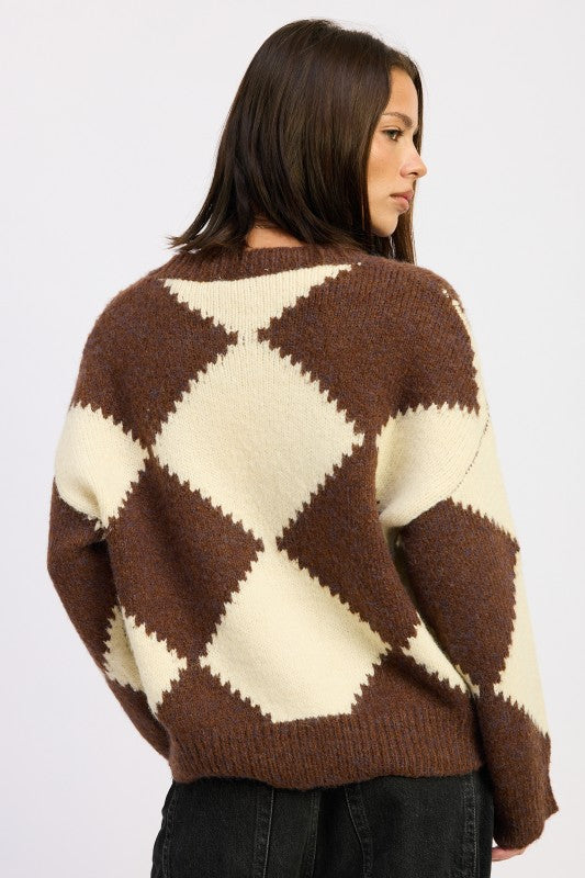 Back view of oversized brown and cream argyle sweater featuring bold diamond knit pattern and relaxed silhouette.-AVAH