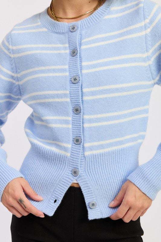 Close up of sky blue and white striped cardigan showing button front detail and ribbed hem