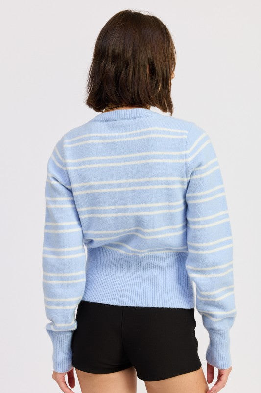 Back view of blue striped knit cardigan showing classic crew neckline
