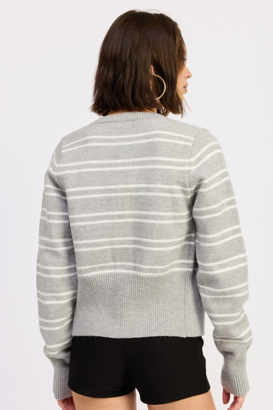 Back view of grey and white striped cardigan with ribbed hem and long sleeves