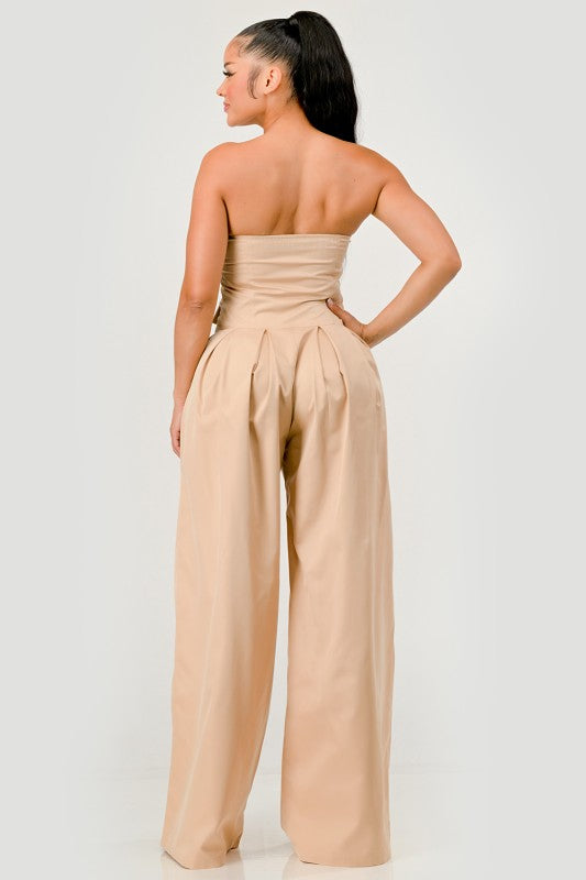 Back view of strapless beige wide-leg jumpsuit with tailored fit