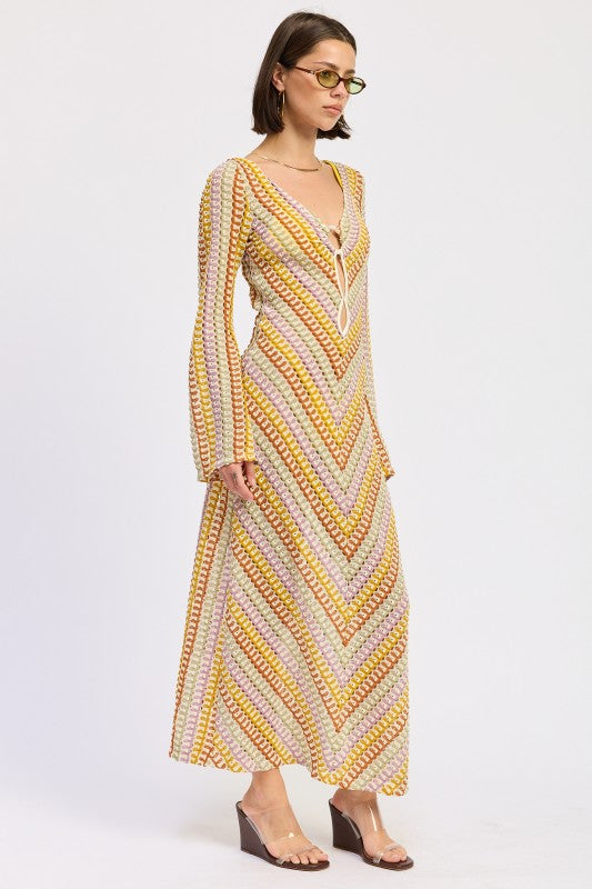 Side view of the Sunwoven Chevron Long Sleeve Maxi Dress showing the flowing maxi length, open knit texture, and softly flared sleeves.