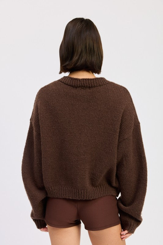 Back view of mocha cardigan showing clean knit texture without embroidery.