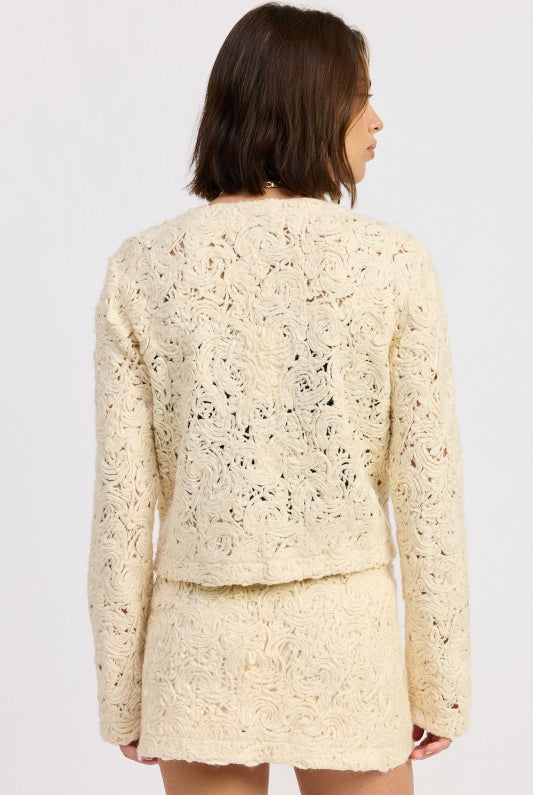 Back view of Ivory Reverie Textured Cropped Jacket highlighting detailed textured pattern and cropped fit.