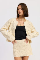 Front view of Ivory Reverie Textured Cropped Jacket in cream, featuring long sleeves and open front design.