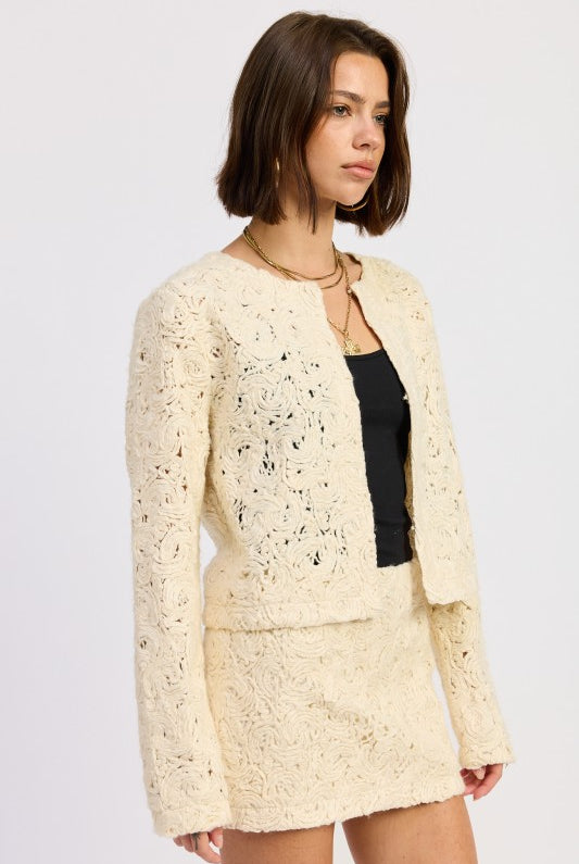 Side view of Ivory Reverie Textured Cropped Jacket showing relaxed silhouette and open neckline.