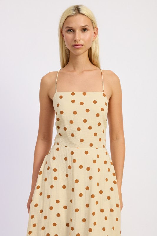 Close-up showing the straight neckline and caramel polka dots.