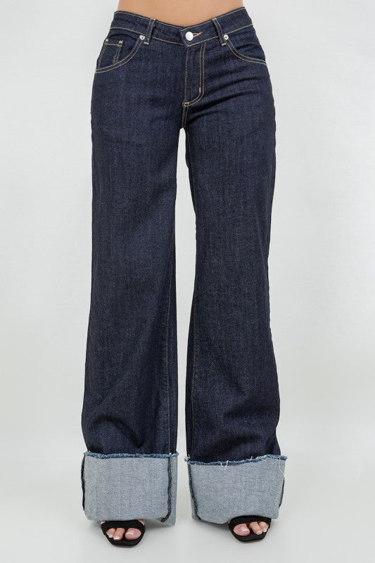 Close up of dark blue wide leg denim with contrast stitching