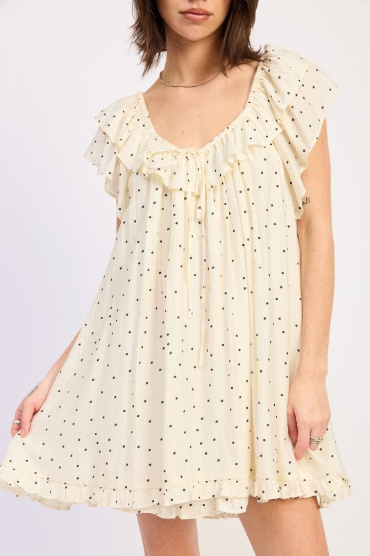 Close up ivory polka dot romper ruffle neckline tie detail