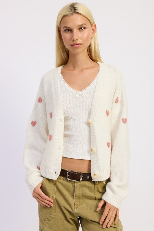 Ivory pink heart cardigan front view on model