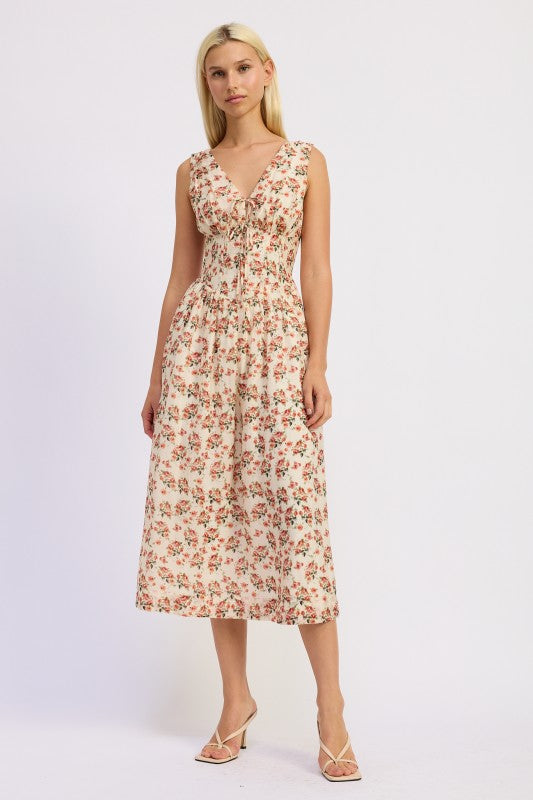 Ivory floral midi dress styled with heels.