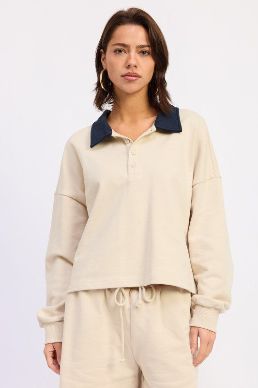 Ivory collared long sleeve cotton top with relaxed fit and contrast collar, styled casually with matching shorts
