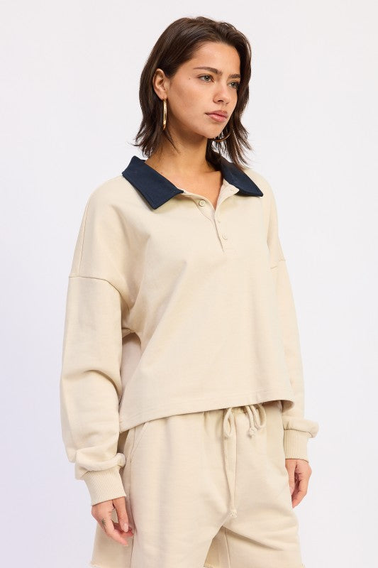 Ivory cotton collared long sleeve top with dropped shoulders and easy, relaxed silhouette