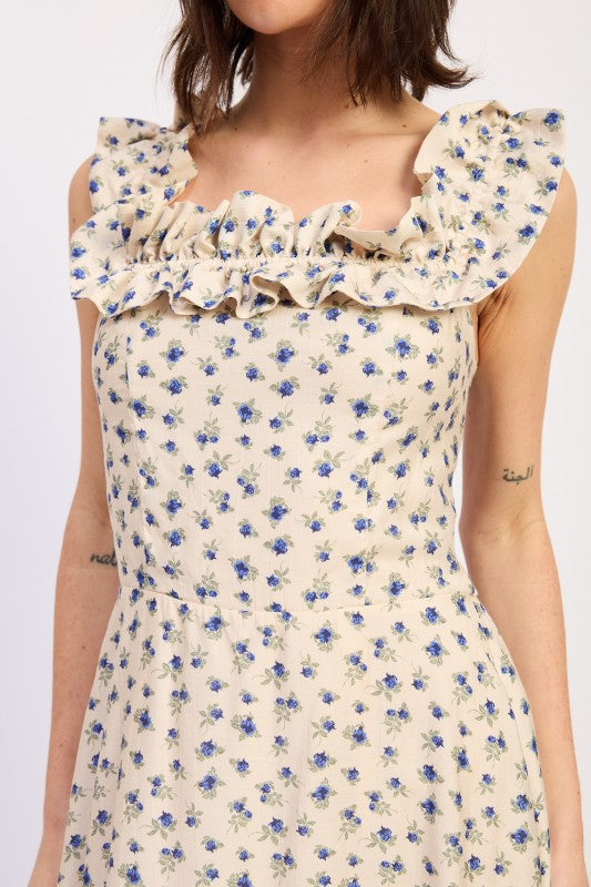 Close up of floral print and ruffle neckline detail