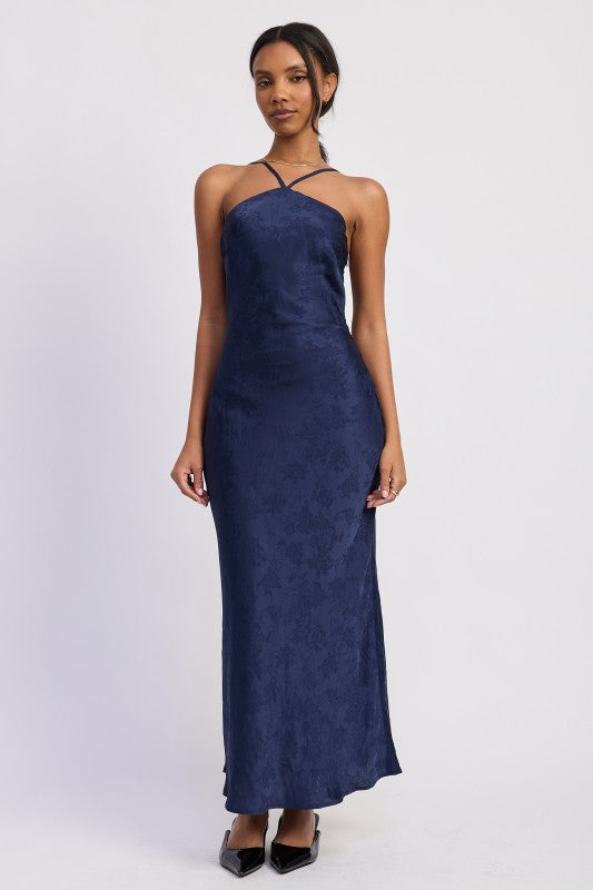 Navy floral jacquard open back maxi dress with cross strap halter neckline worn front view