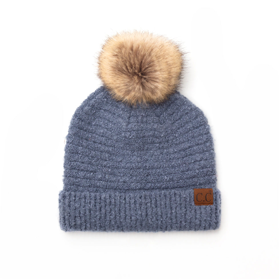 light blue boucle knit hat with faux fur pom