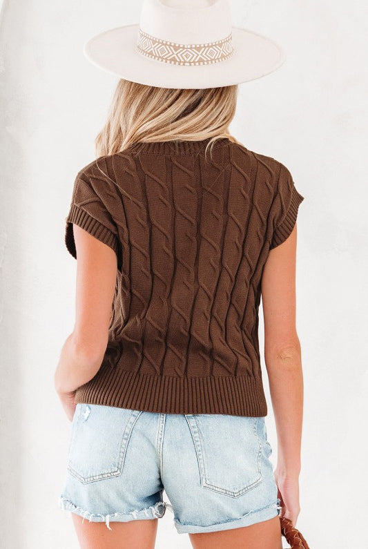 Back view of brown cable knit sleeveless top showing ribbed hem and cap sleeves.
