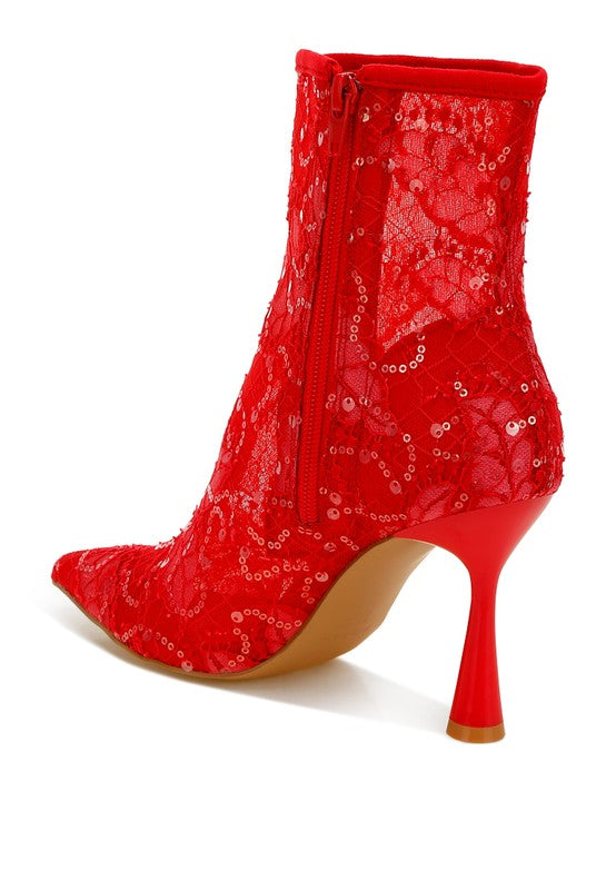 Back view of red lace ankle boot with sculpted heel