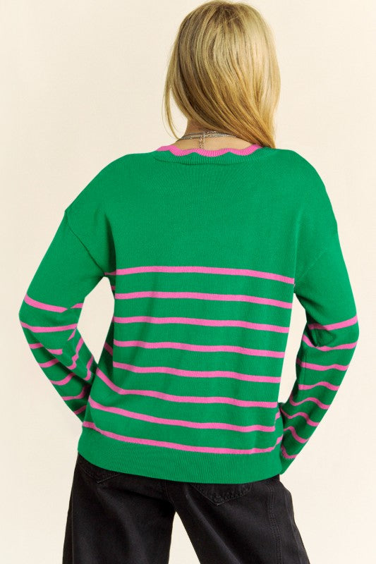 Back view of green striped cardigan with pink trim and long sleeves