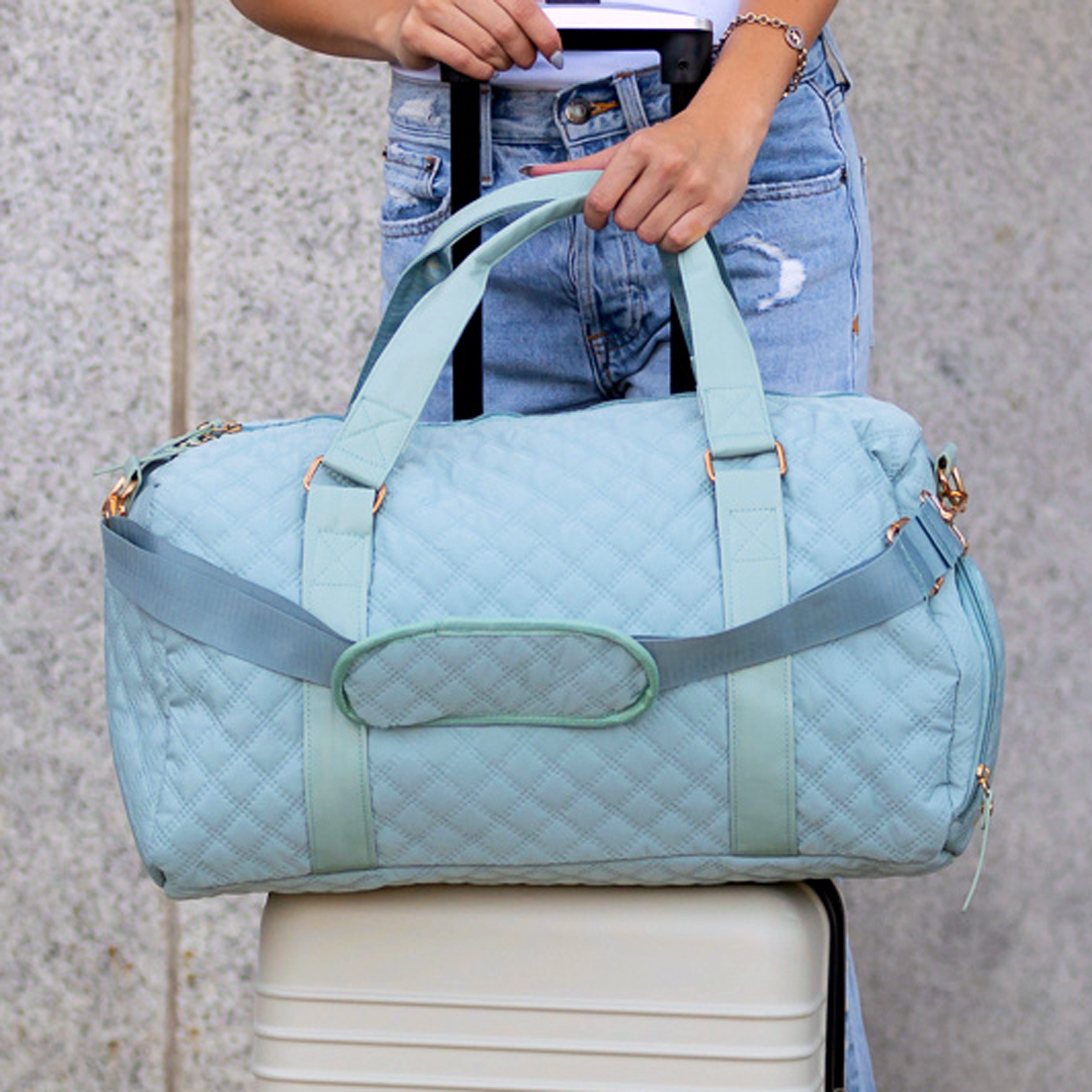 AVAH-Weekend Bliss Quilted Travel Bag in blue featuring a timeless design with vegan leather accents, Exterior open side pocket, luggage/trolley sleeve, shoe compartment, zip pocket and gold hardware