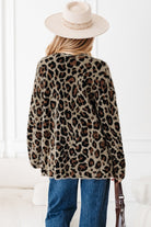 Back view of leopard print cardigan displaying full pattern.