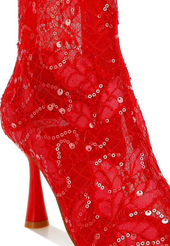Close-up of red sheer lace ankle boot with sequin detailing