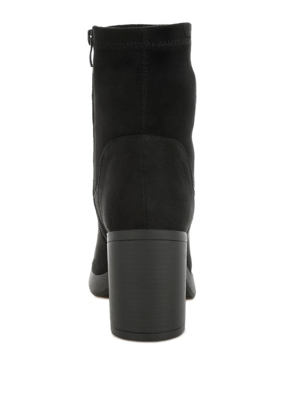 Back view of black platform boot showing round toe design.