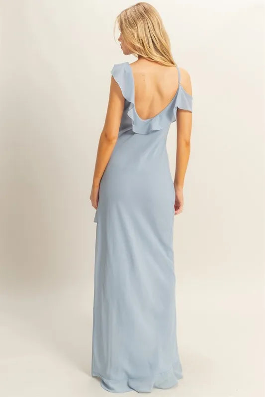 Back view of blue chiffon ruffle maxi dress with low scoop back and asymmetrical neckline