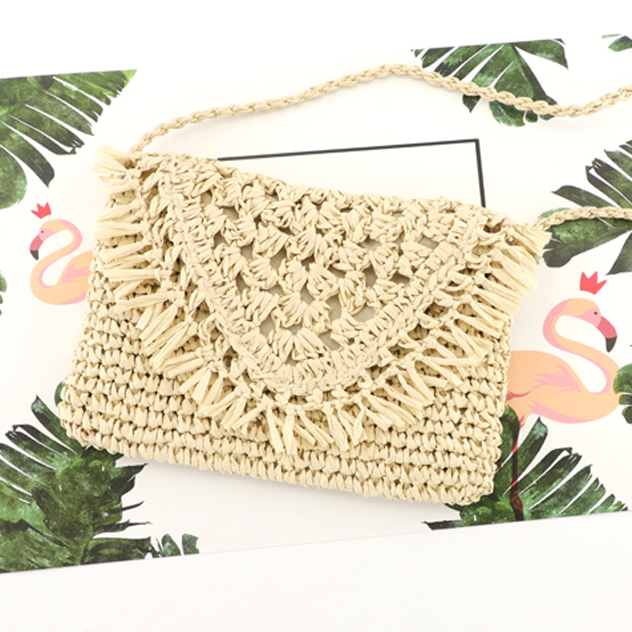 Close up of cream woven straw crossbody with fringe flap detail, front view-AVAH
