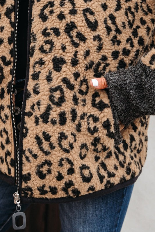 close-up of leopard sherpa texture and pocket detail