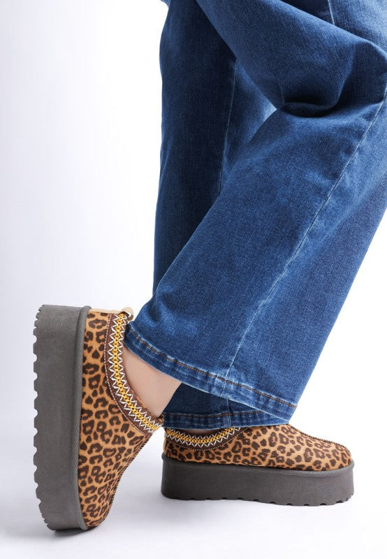 side profile of leopard flatform shoes with embroidered trim
