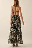 Back view of strapless floral maxi dress showing open back with three horizontal straps and ankle-length hem