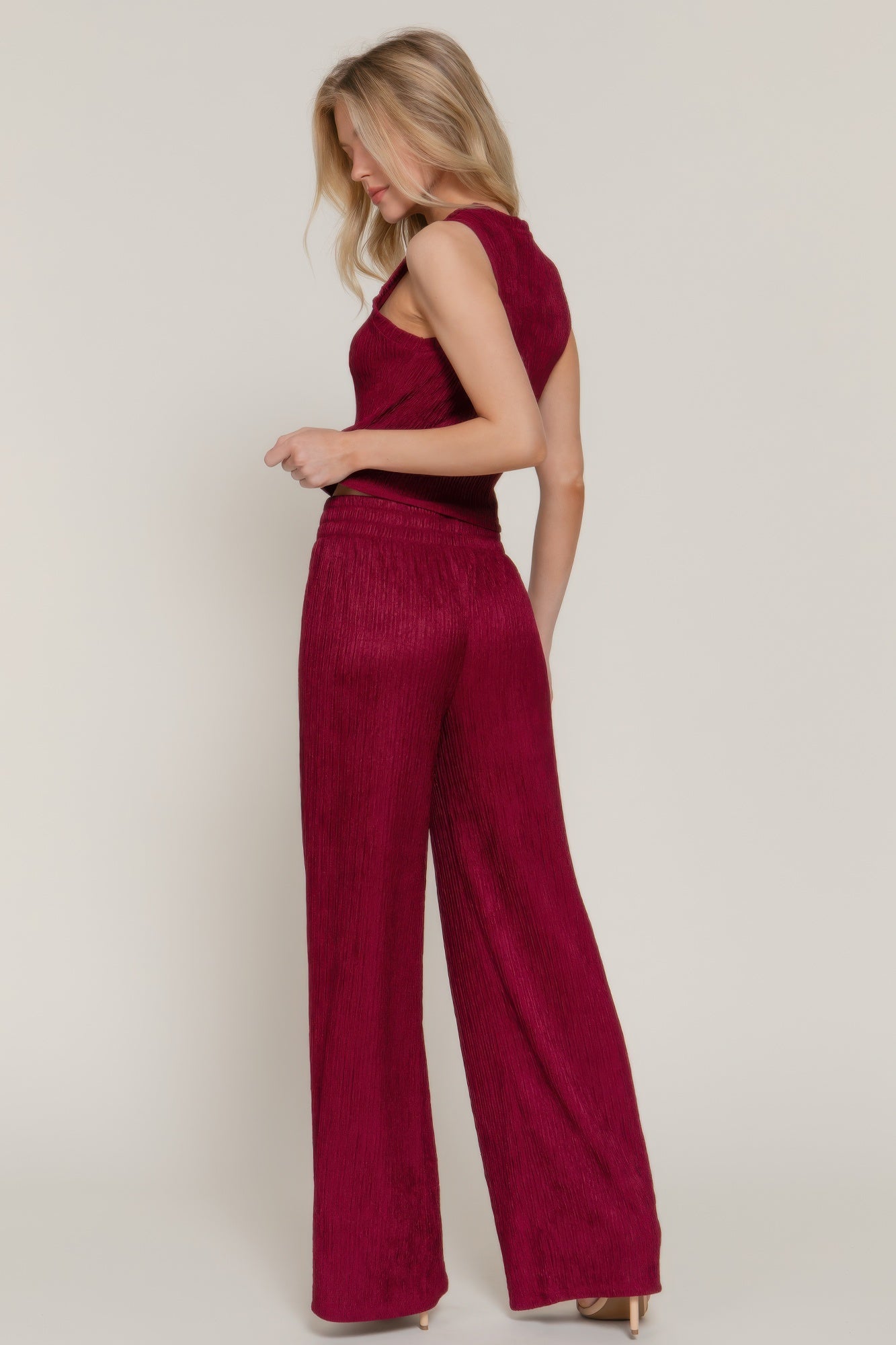 Rear view of model wearing wide leg pants and sleeveless top- matching set