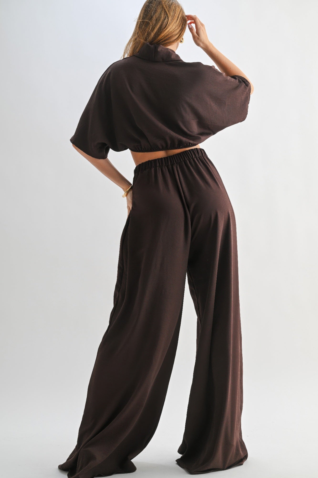 Rear view of brown loungewear set showing elastic waistband and loose fit.
