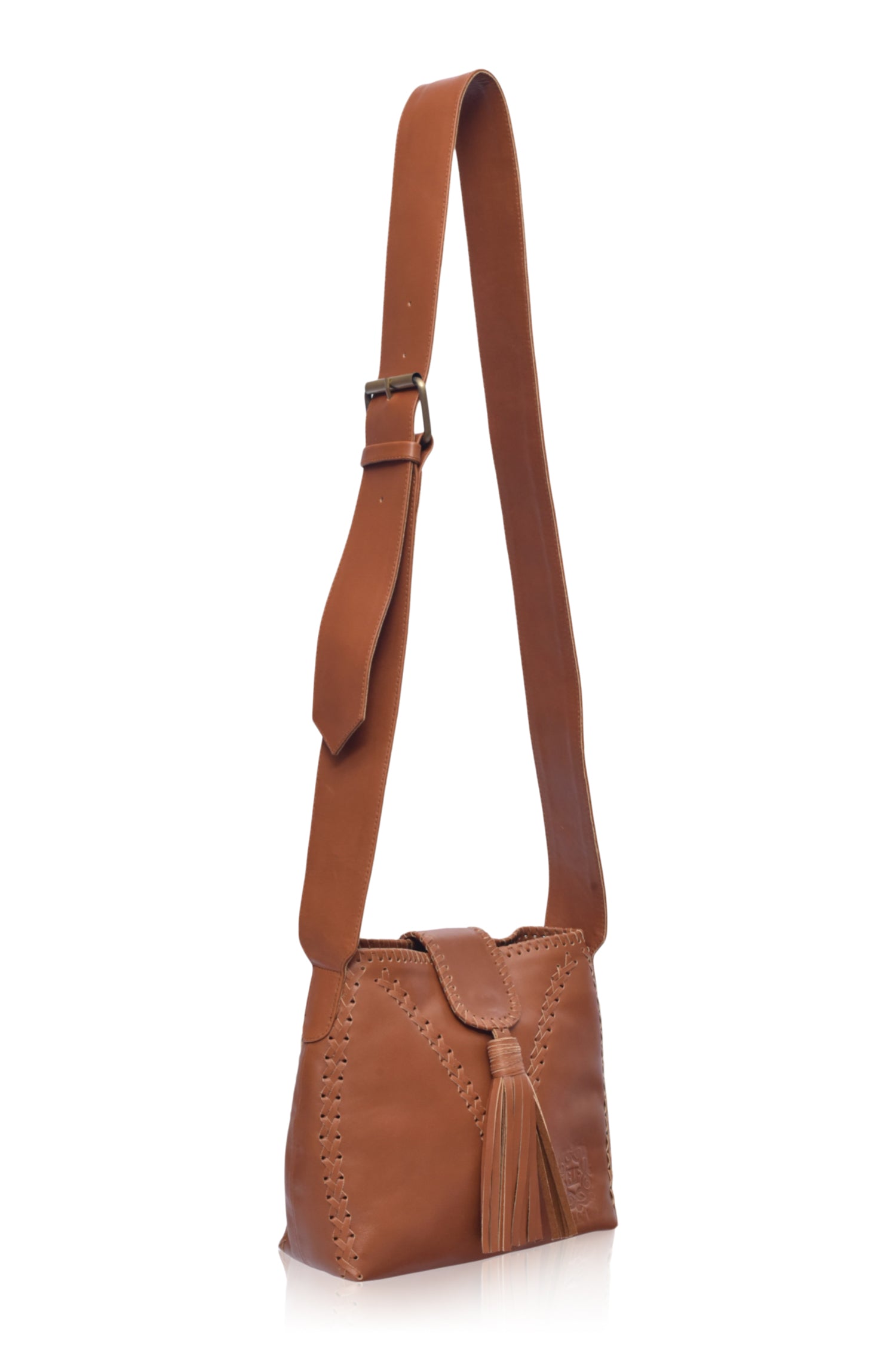 Camel leather handbag with fringe details and wide crossbody strap on a white background, 3/4 view