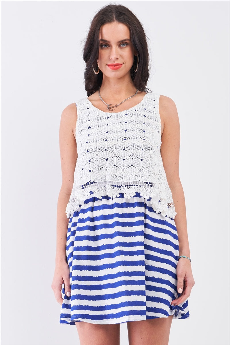 Front view of blue and white striped mini dress with white crochet overlay bodice