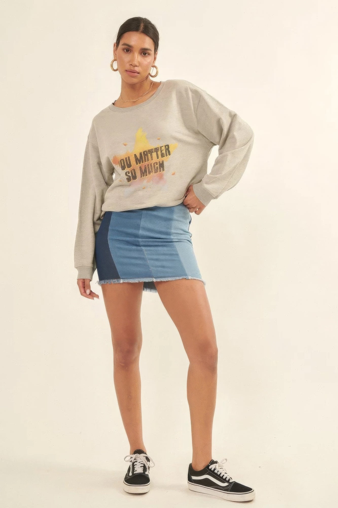 Full outfit view of Radiance Reminder Graphic Sweatshirt styled with sneakers and gold hoop earrings-AVAH