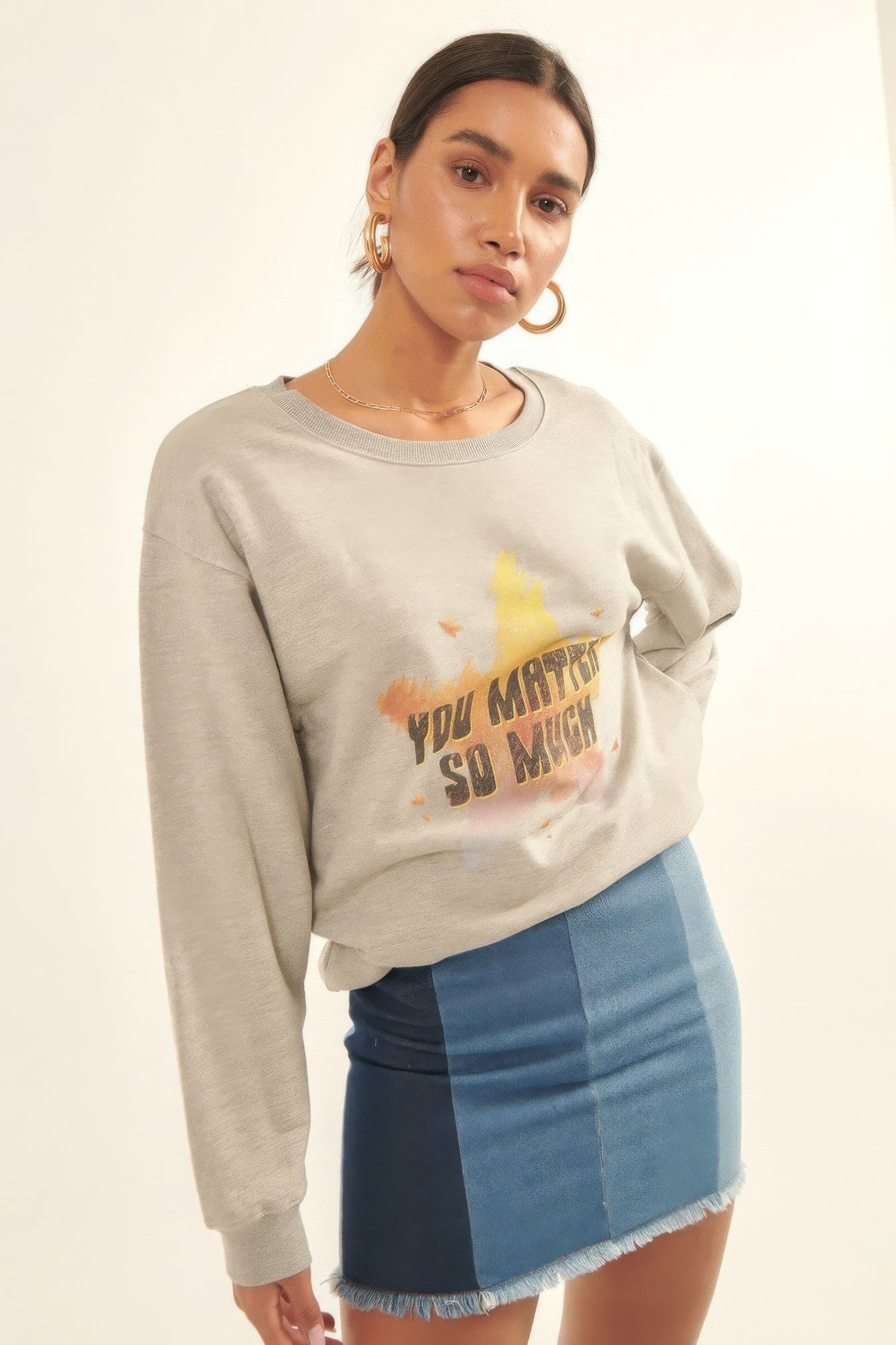 Casual styled Radiance Reminder Graphic Sweatshirt paired with denim mini skirt-AVAH