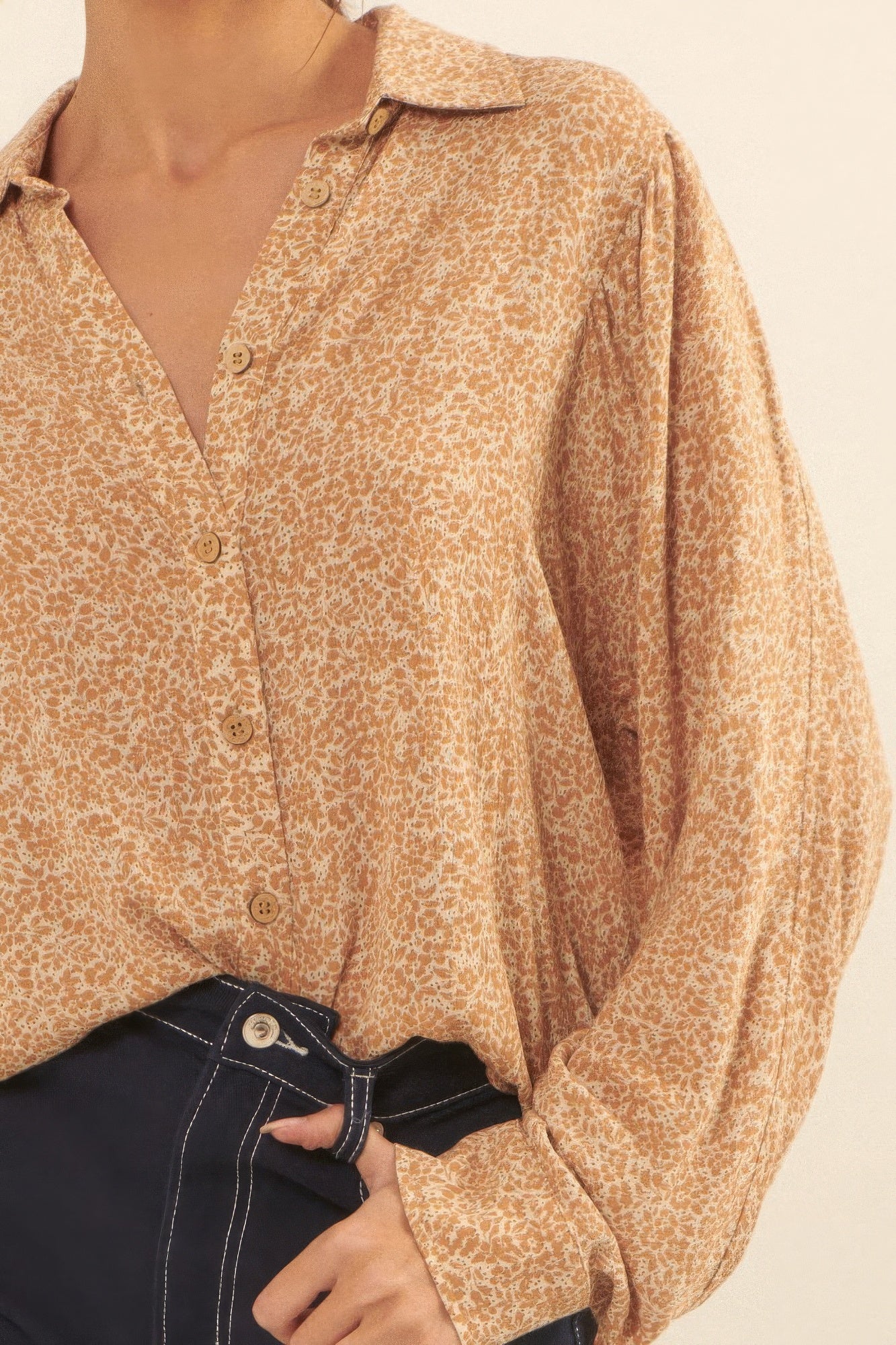 Detailed close-up of golden floral button-up blouse front and buttons-AVAH