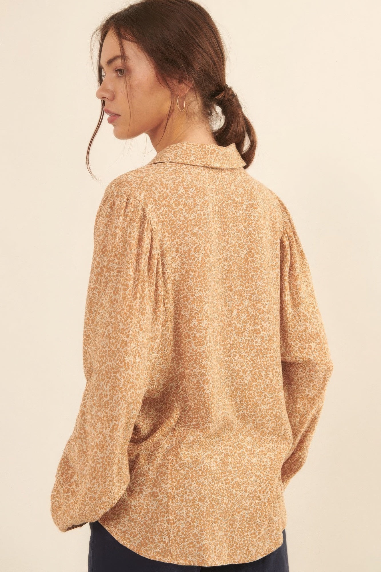 Back view of golden floral button-up blouse showing flowy fit-AVAH