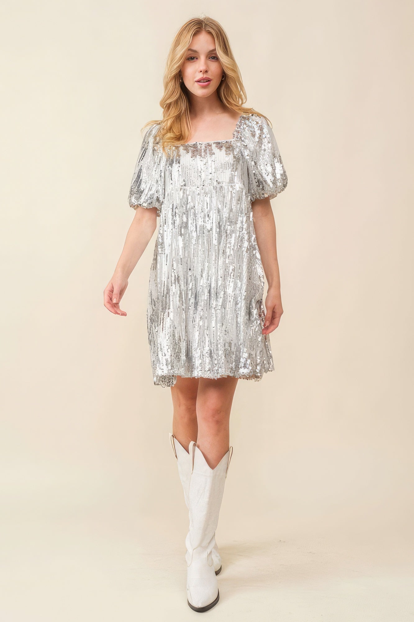 Full-length front view of silver sequin party mini dress with puff sleeves.