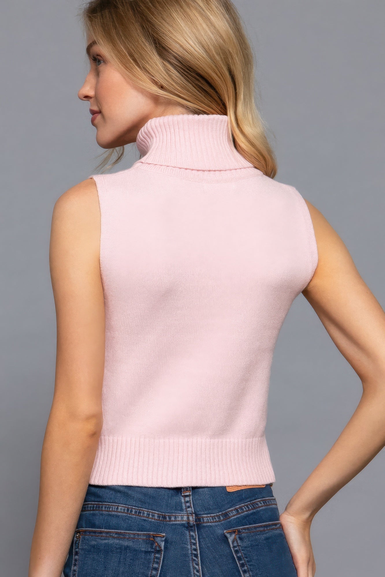 Back view of blush sleeveless knit turtleneck top-AVAH